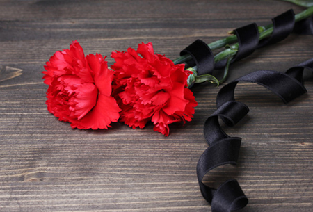 carnations and black ribbon